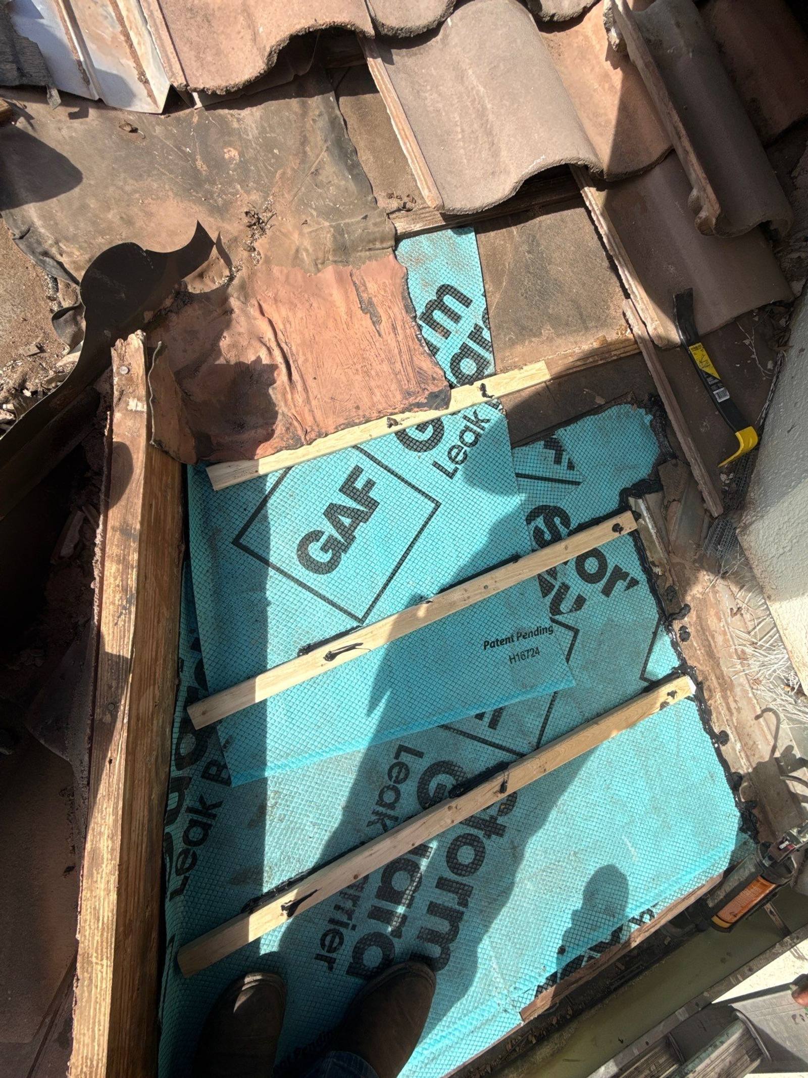 Underlayment and tile repair in progress
